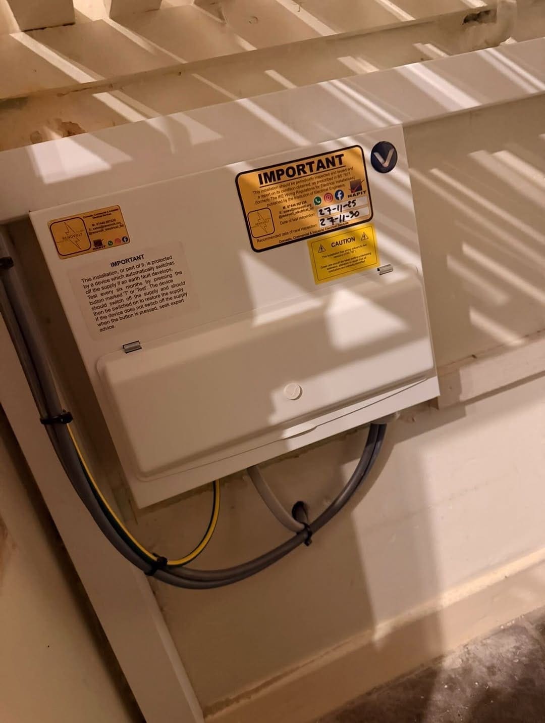 Consumer unit with a Renovolt NAPIT test certificate sticker